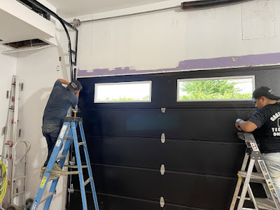 workers installing garage door